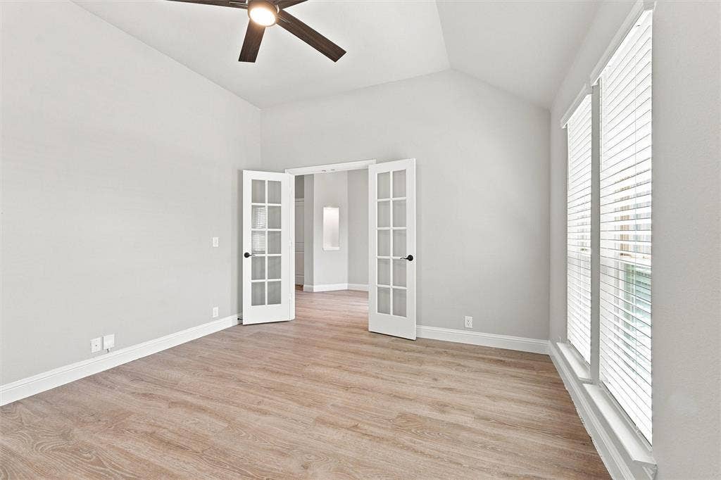 5225 Rowlan Row, Midlothian, TX 76065 Vaulted ceiling with a ceiling fan, wood-finish flooring, and double French doors