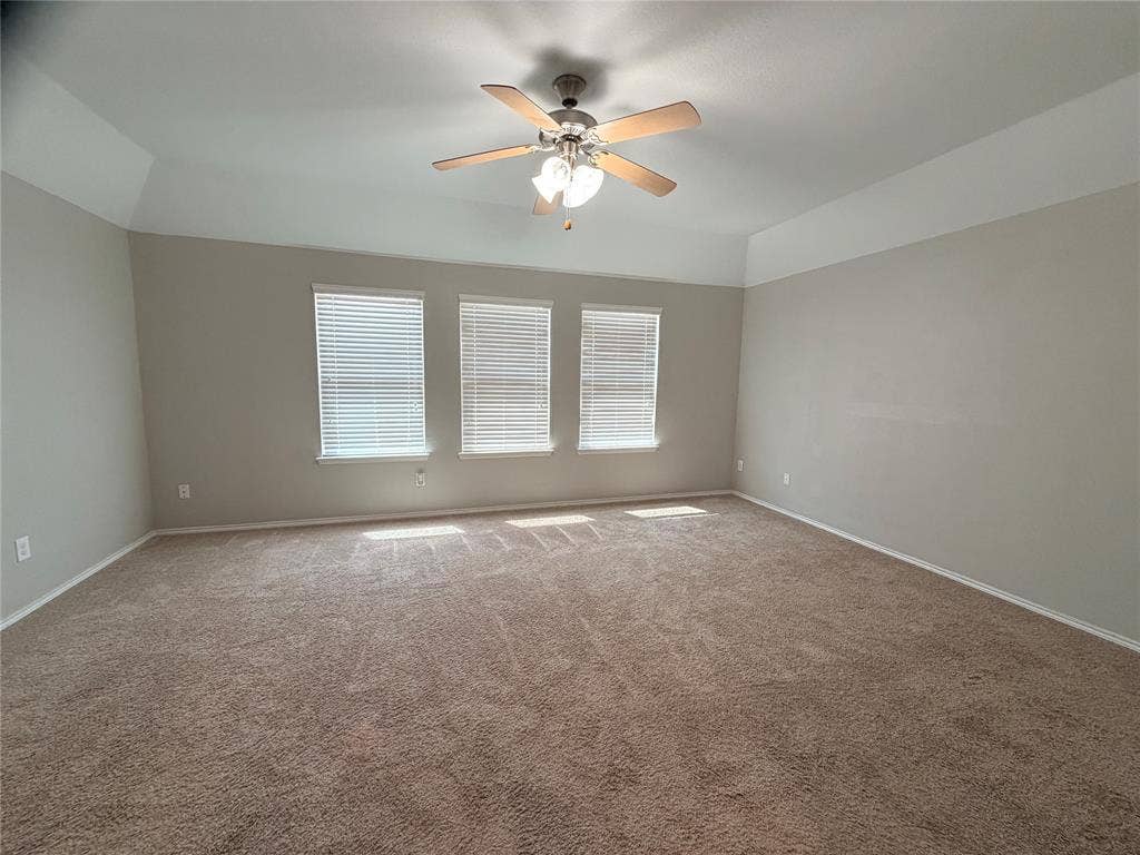 4103 Portrush Drive, Heartland, TX 75126 Tray ceiling with a built-in ceiling fan and light fixture