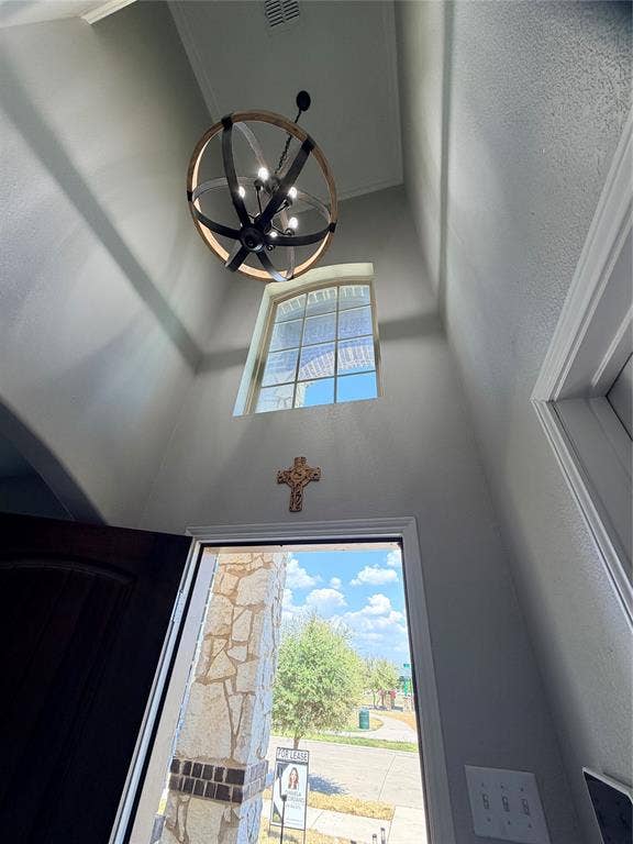 4103 Portrush Drive, Heartland, TX 75126 Front door. Vaulted ceiling with an architectural light fixture and an arched window