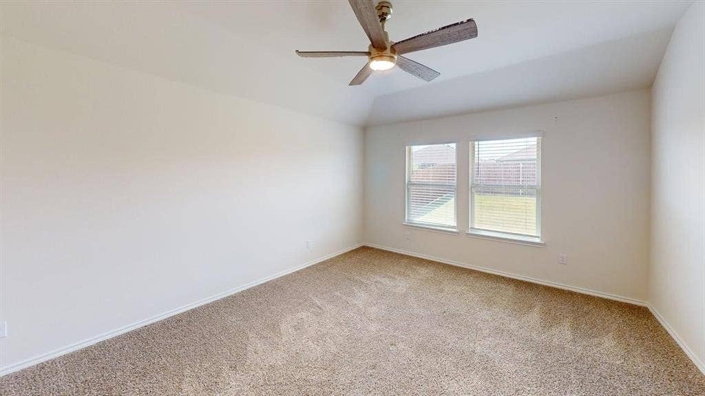 6534 Whitecap Drive, Princeton, TX 75407 Vaulted ceiling with an attached ceiling fan and light fixture
