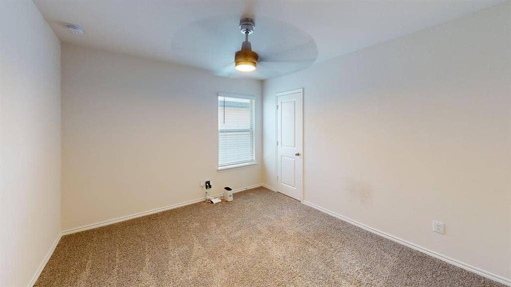 6534 Whitecap Drive, Princeton, TX 75407 Wall-to-wall carpeting, neutral wall finishes, window with blinds, and a ceiling fan with integrated lighting