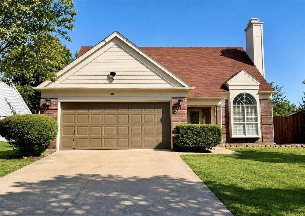 418 Newberry Street, Grand Prairie, TX 75052 Brick and siding exterior with an attached garage, arched window, and a prominent chimney