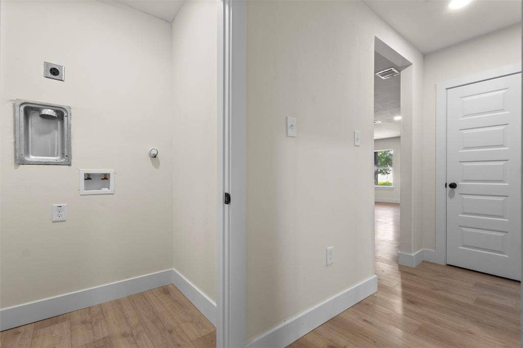 212 E Marguerita Drive, Garland, TX 75040 Dedicated utility area with wood-finish flooring