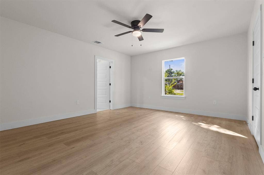 212 E Marguerita Drive, Garland, TX 75040 Light wood-finish flooring with white walls