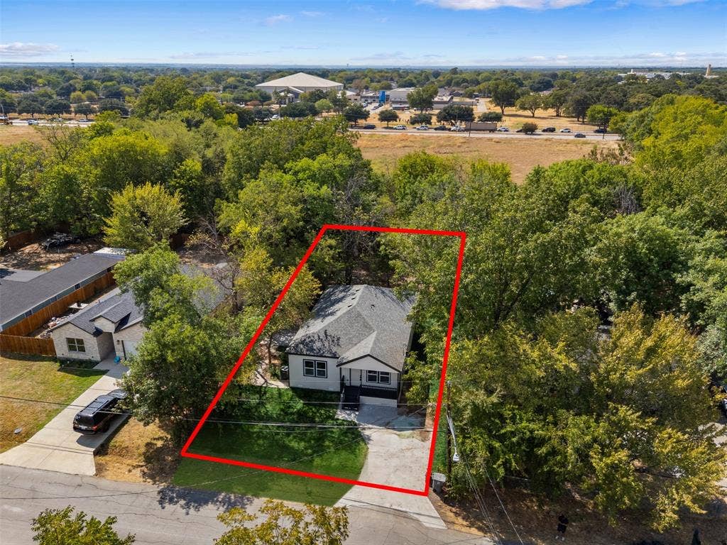 333 Levant Avenue, Dallas, TX 75217 Single-story residence with a gabled roof and light-colored siding