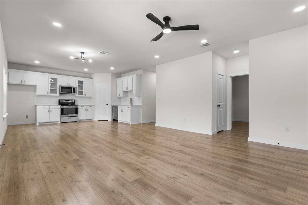 333 Levant Avenue, Dallas, TX 75217 Open-concept living area featuring wood-finish flooring, recessed lighting, and a modern ceiling fan