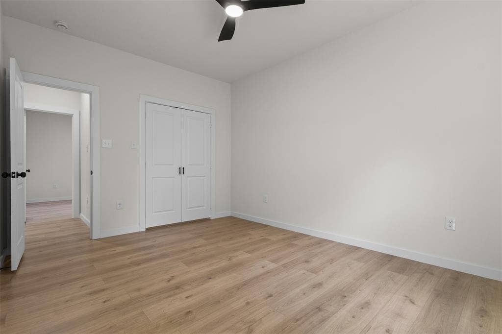 333 Levant Avenue, Dallas, TX 75217 Neutral paint palette with wood-finish flooring