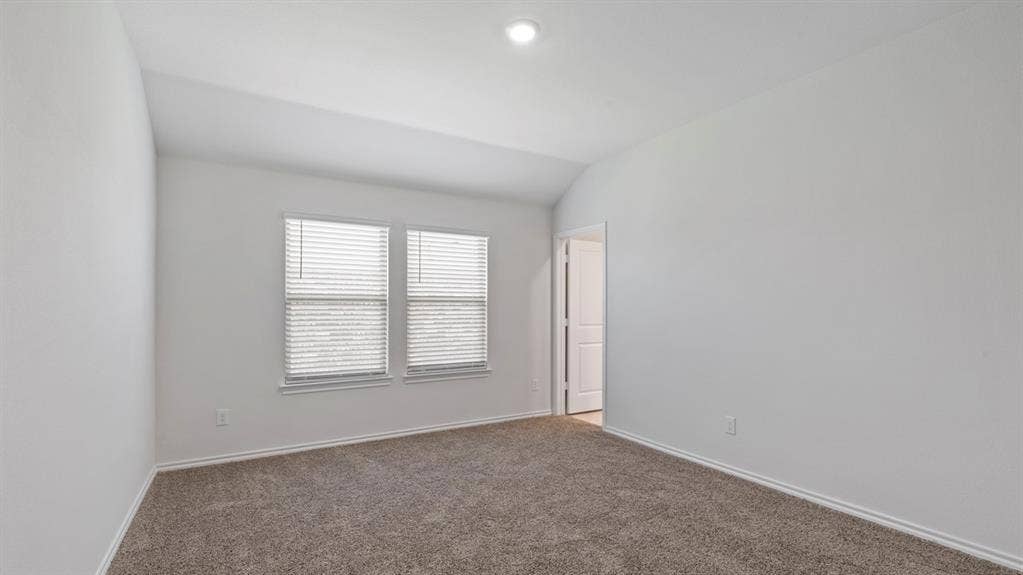 193 Brooks Street, Bullard, TX 75757 Vaulted ceiling with recessed lighting, neutral tone carpet, and dual windows