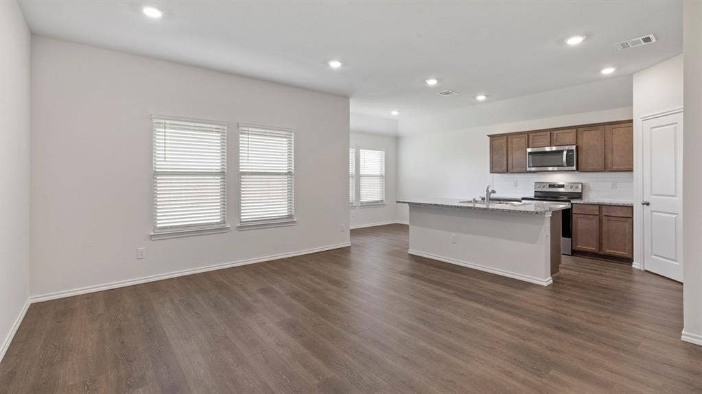 193 Brooks Street, Bullard, TX 75757 Open-concept living area featuring wood-finish flooring, recessed lighting, and ample natural light