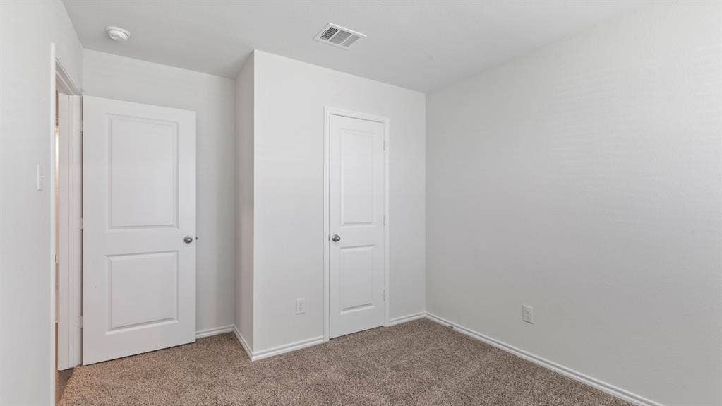 193 Brooks Street, Bullard, TX 75757 Neutral tone wall finishes, white trim, and carpeted flooring