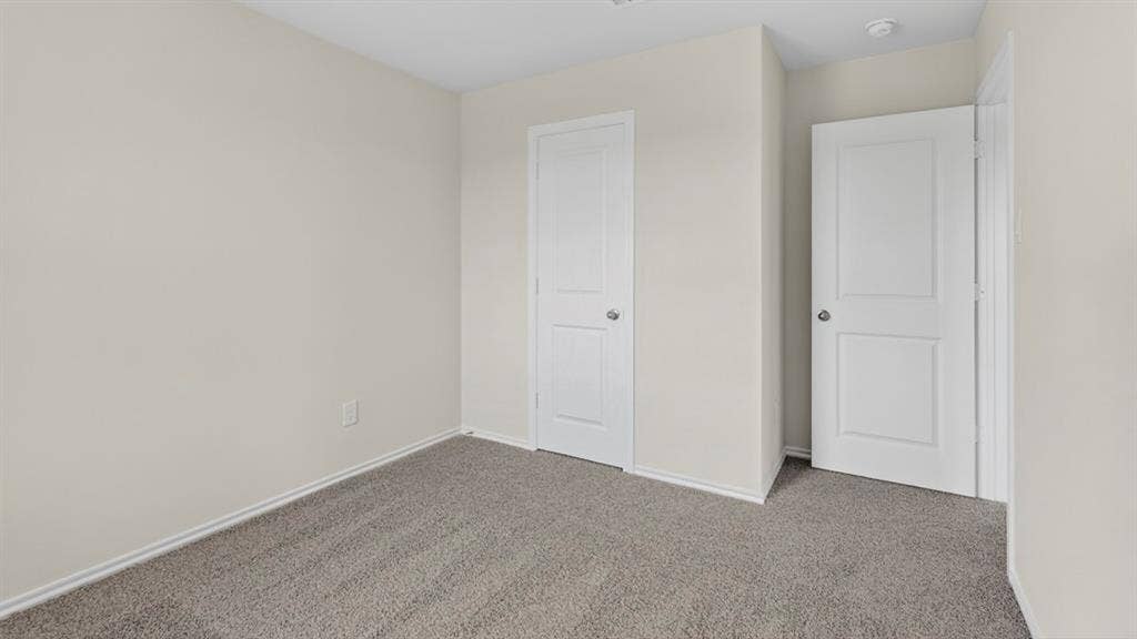 201 Brooks Street, Bullard, TX 75757 Neutral wall paint and plush carpeting