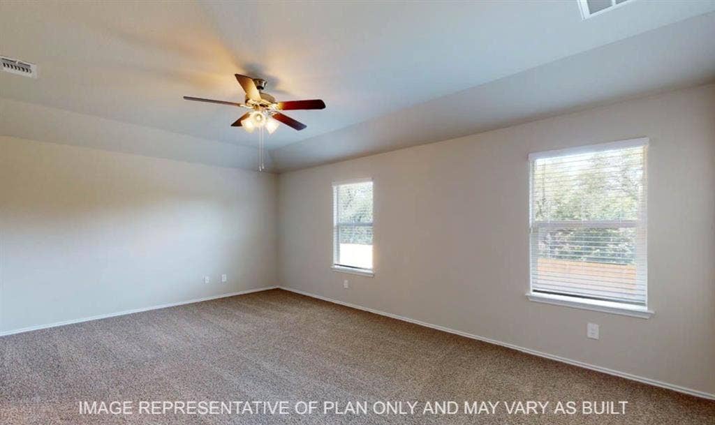 10217 Neptune Court, Waco, TX 76708 Carpeted room with a ceiling fan, dual windows, and neutral wall tones