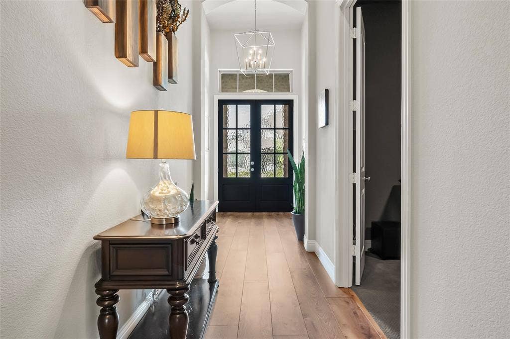 1113 12th Street, Argyle, TX 76226 Doorway to outside with a chandelier, french doors, and light hardwood / wood-style floors