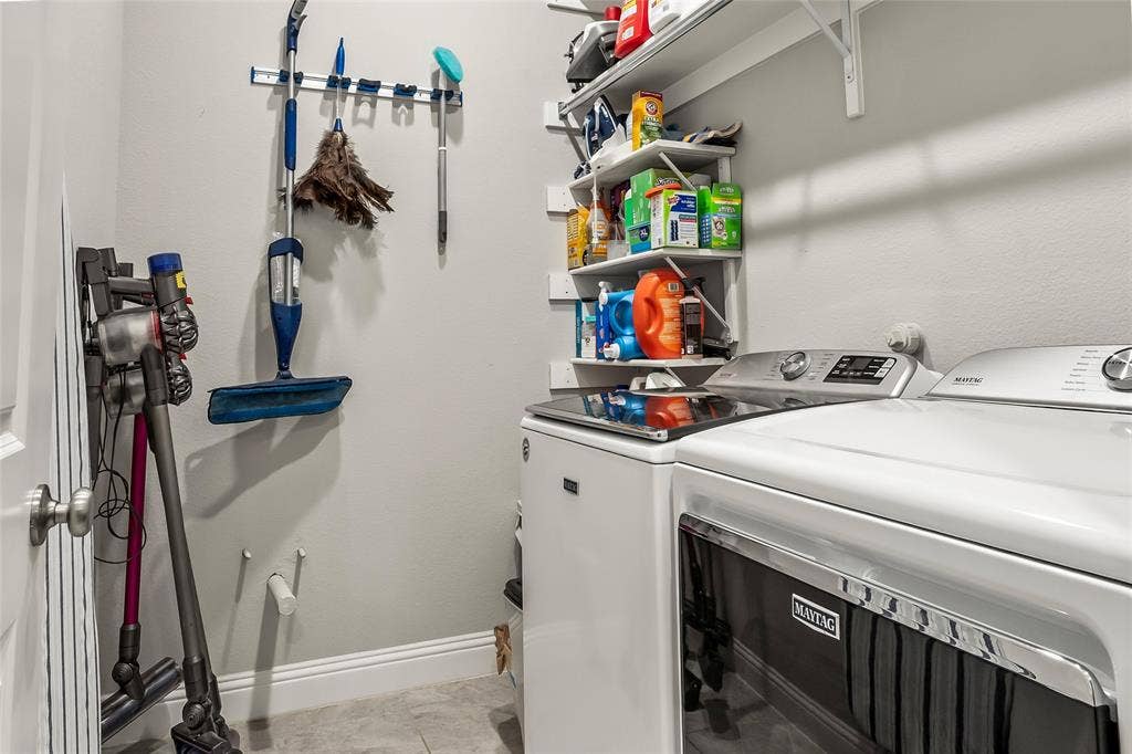 1113 12th Street, Argyle, TX 76226 Washroom featuring light tile patterned floors and washing machine and clothes dryer