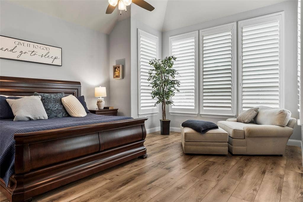 1113 12th Street, Argyle, TX 76226 Bedroom with hardwood / wood-style floors, ceiling fan, and lofted ceiling