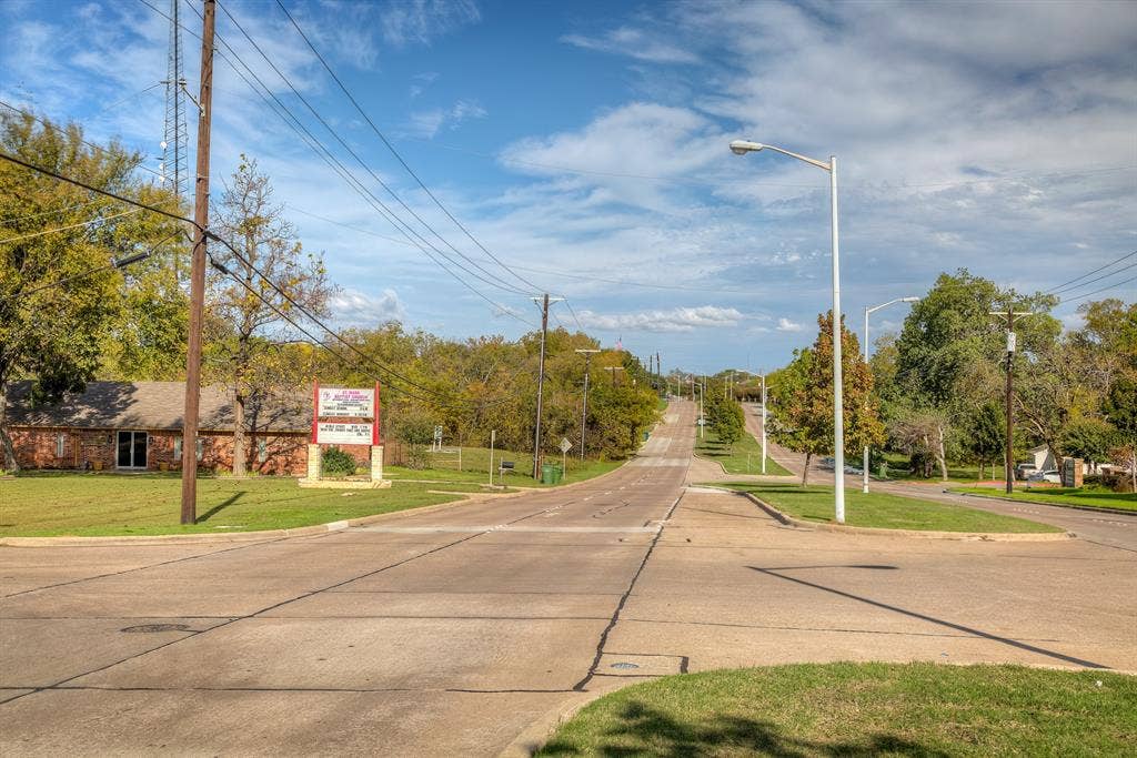 545 Rowlett Road, Garland, TX 75043 View of concrete street with curbs and street lights