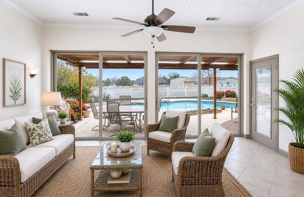 1908 Meadow Springs Drive, Haslet, TX 76052 Sunroom with Sliding glass doors opening to an outdoor patio with a swimming pool, wood-paneled ceiling, and a ceiling fan