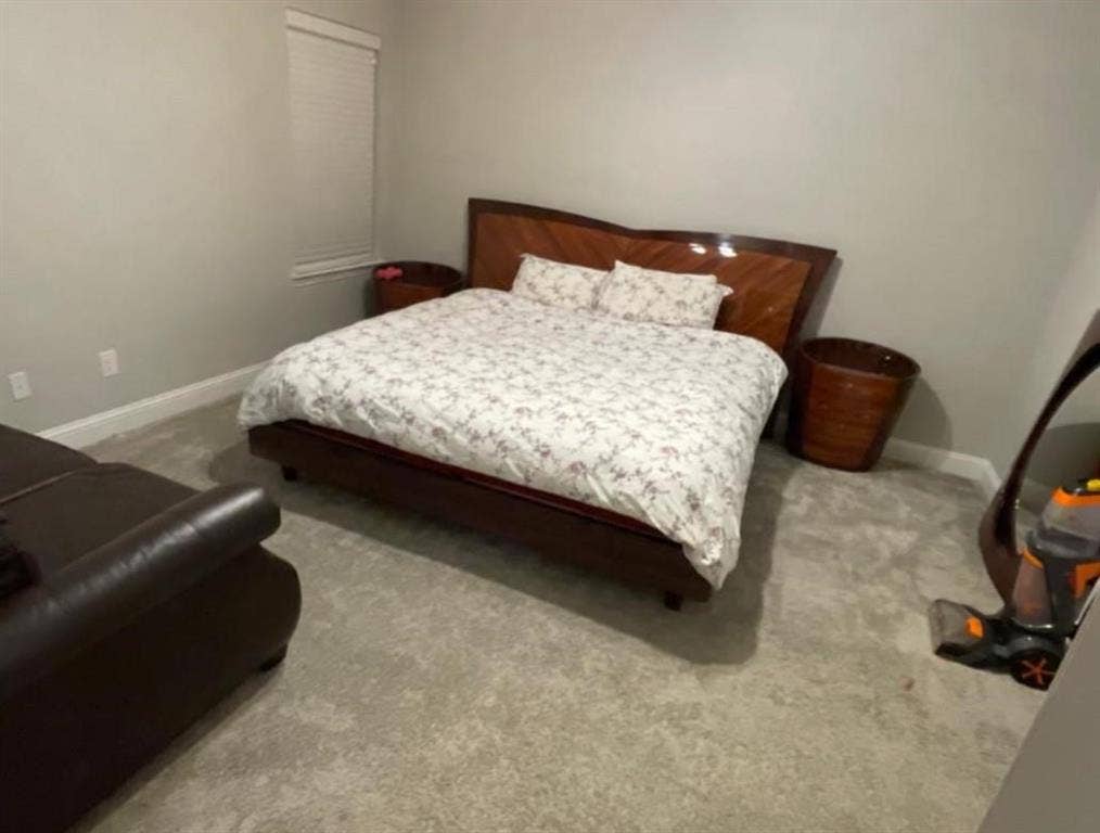 632 Redwood Drive, Greenville, TX 75402 Light gray wall paint, white trim, and light gray carpeted flooring
