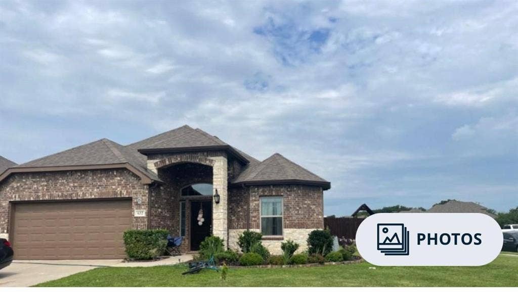 632 Redwood Drive, Greenville, TX 75402 Brick and stone exterior with architectural shingles