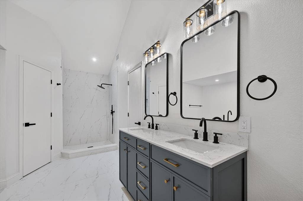 1528 Estrella Drive, Plano, TX 75074 Dual vanity with quartz countertop, undermount sinks, and matte black fixtures