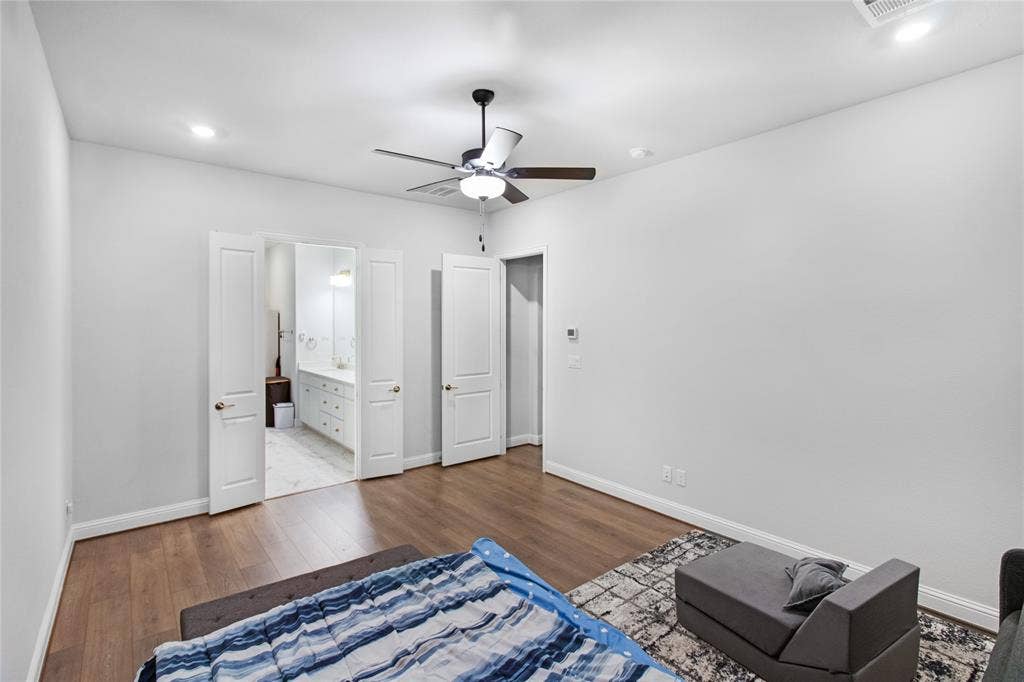1531 20th street, Argyle, TX 76226 Wood-finish flooring with a ceiling fan