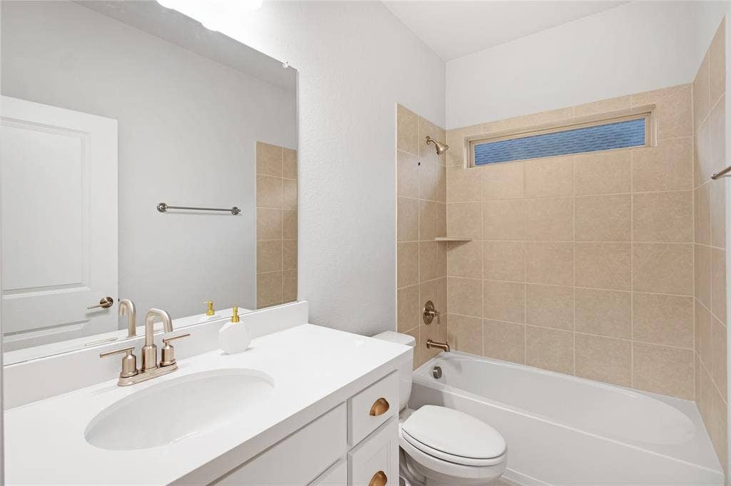1531 20th street, Argyle, TX 76226 Vanity with integrated sink, brushed nickel faucet, and white cabinetry