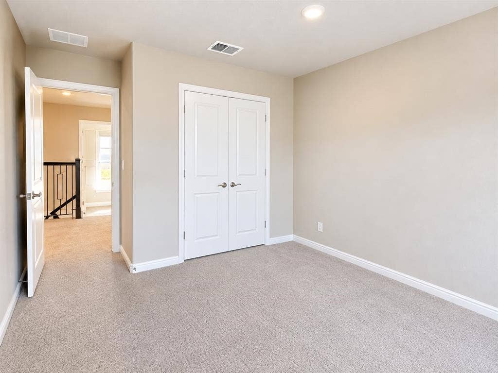 7204 Running Iron Trail, Sachse, TX 75048 Neutral-toned carpeting throughout, recessed ceiling lighting, and white trim