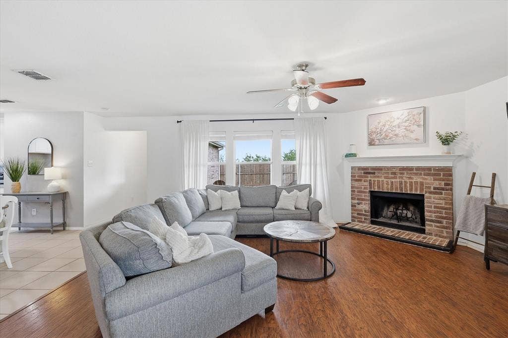 300 Highland Ridge Drive, Wylie, TX 75098 Spacious living room with gas fireplace and views to the expansive backyard