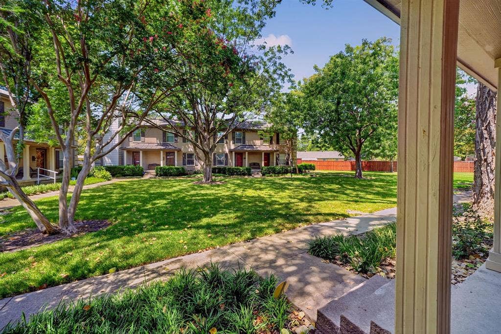 6435 Oriole Drive, #6435, Dallas, TX 75209 The view of the lush lawn of the greenbelt from the front porch.
