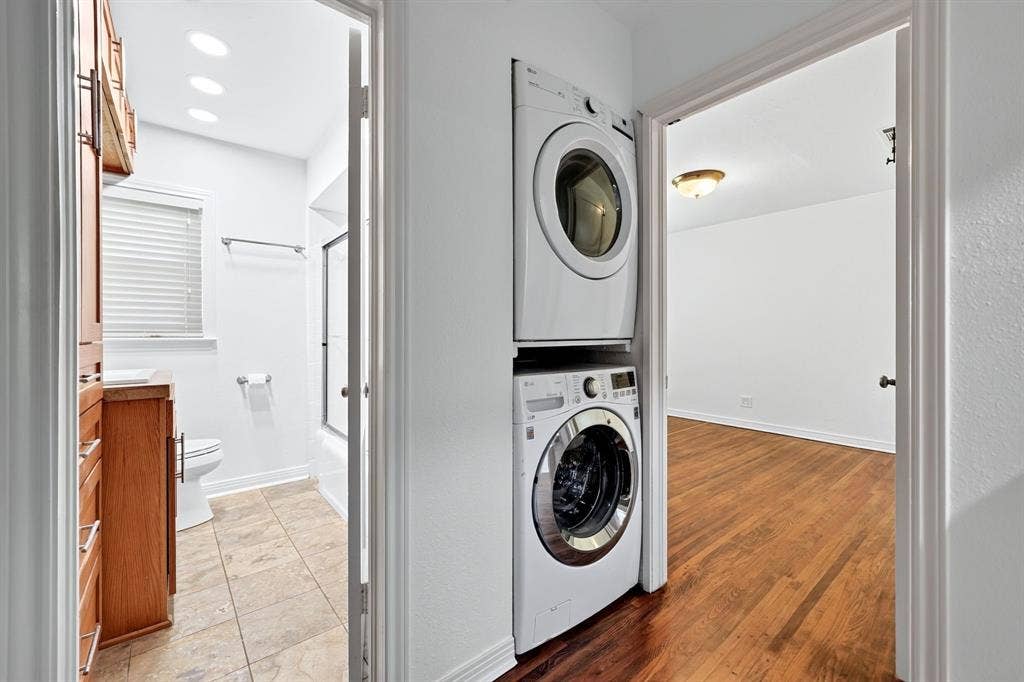 6435 Oriole Drive, #6435, Dallas, TX 75209 Stacked full-size washer and dryer convey with the property.