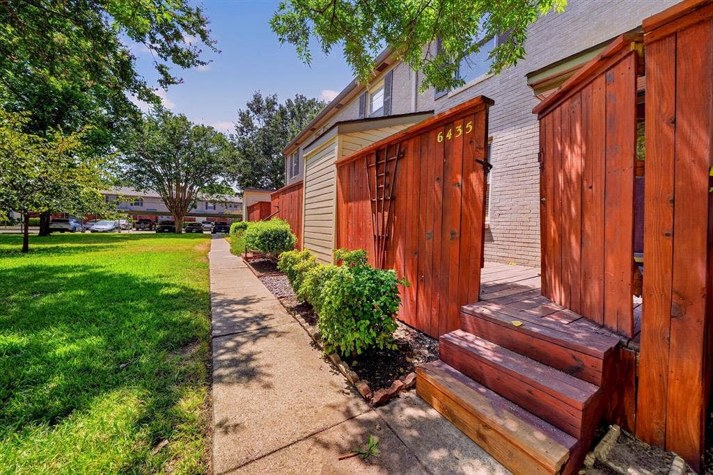 6435 Oriole Drive, #6435, Dallas, TX 75209 Back steps lead to the community greenbelt at the rear of the property.