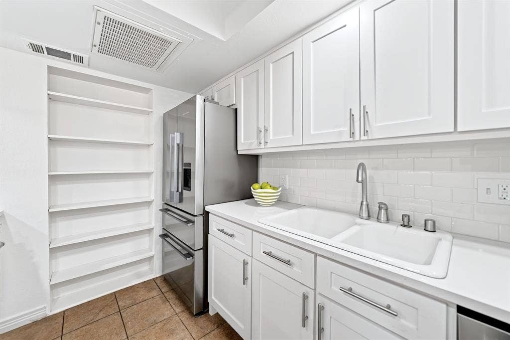 6435 Oriole Drive, #6435, Dallas, TX 75209 Open shelving provides plenty of space for display or for canned goods.