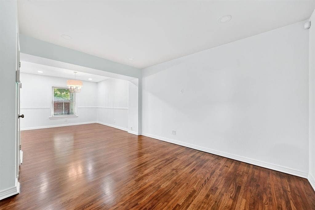 6435 Oriole Drive, #6435, Dallas, TX 75209 Recently refinished hardwood floors gleam in the living room.
