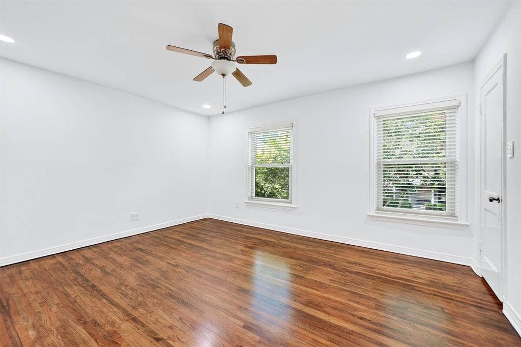 6435 Oriole Drive, #6435, Dallas, TX 75209 Two windows flood the primary bedroom with natural light.
