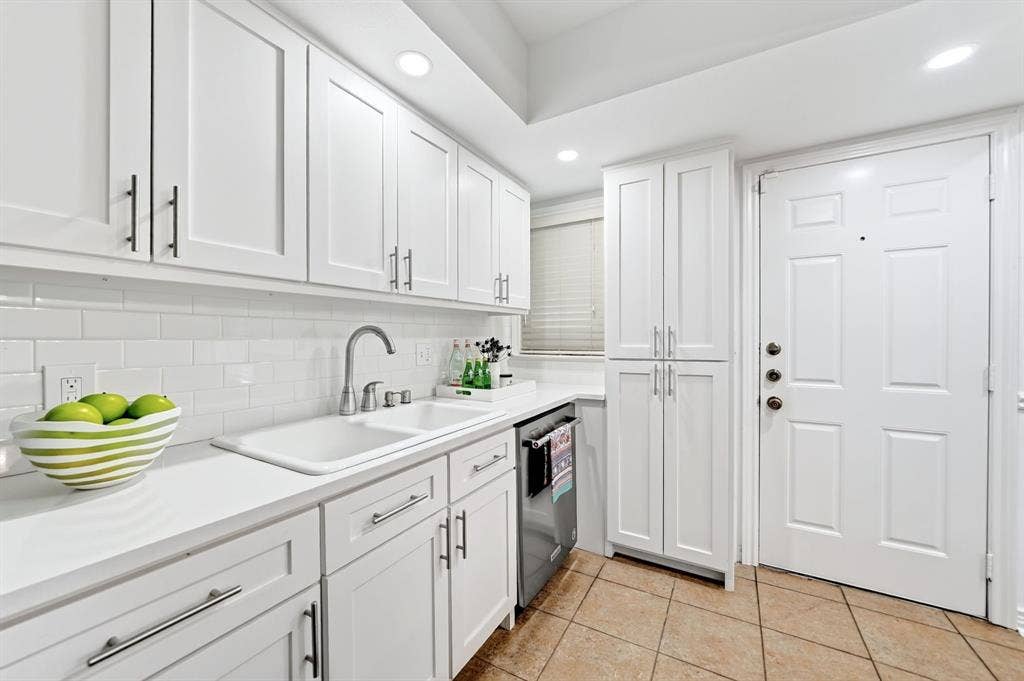 6435 Oriole Drive, #6435, Dallas, TX 75209 Cabinetry was added next to the door for additional storage.
