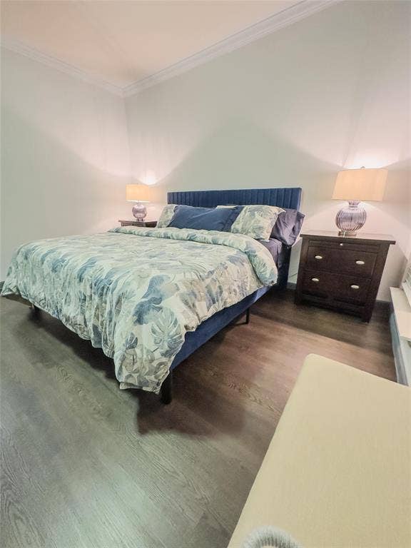 12146 Gonzales Drive, Frisco, TX 75035 Bedroom featuring ornamental molding and wood finished floors
