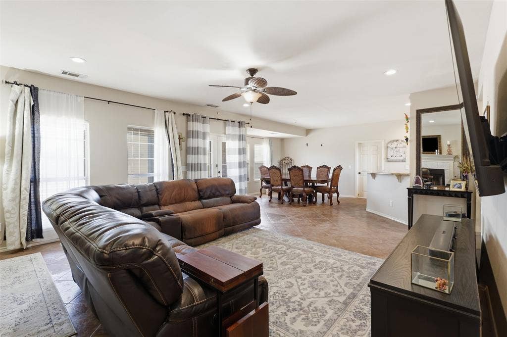 5642 County Road 597, Farmersville, TX 75442 Living Room flows to the dining room and kitchen allowing for seamless entertaining.