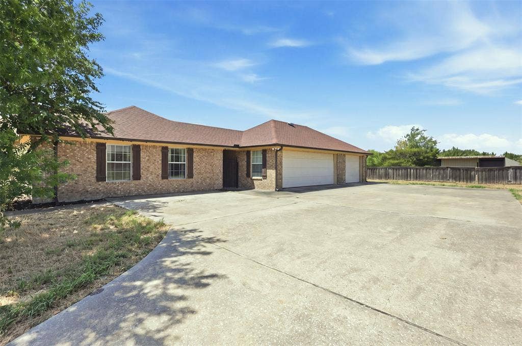 5642 County Road 597, Farmersville, TX 75442 3-Car garage and extended driveway gives ample room for parking and storage.