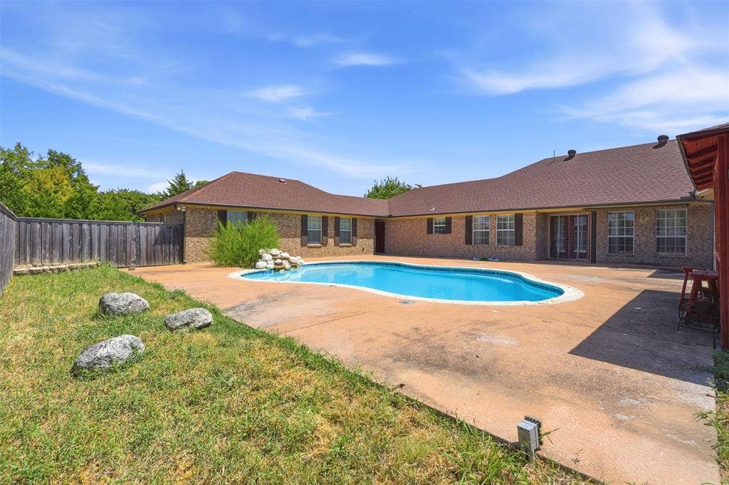 5642 County Road 597, Farmersville, TX 75442 Alternate view of pool looking towards house and water feature.