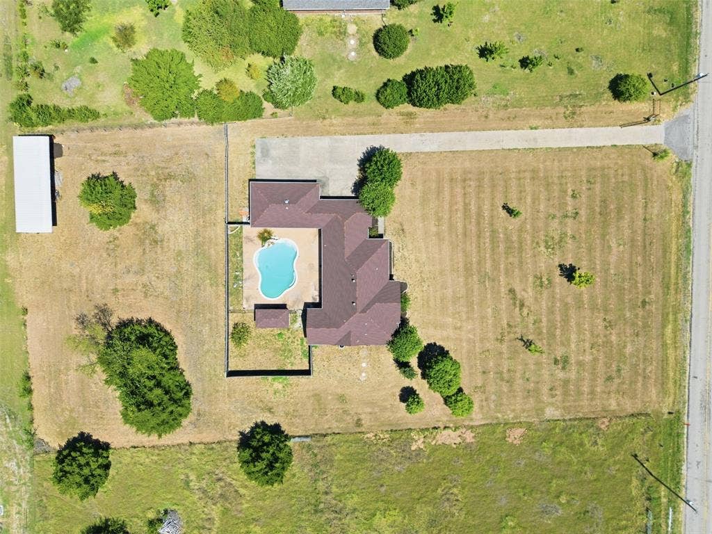 5642 County Road 597, Farmersville, TX 75442 Aerial View detailing the pool and stable.