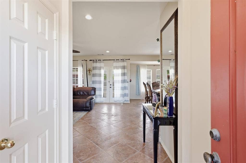 5642 County Road 597, Farmersville, TX 75442 Open the door to entry and open concept living.