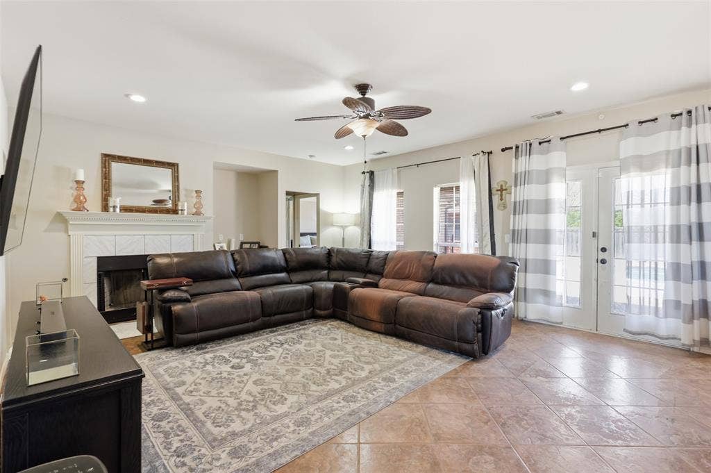 5642 County Road 597, Farmersville, TX 75442 The wall of windows add lots of natural light and lead to the private oasis in the backyard.