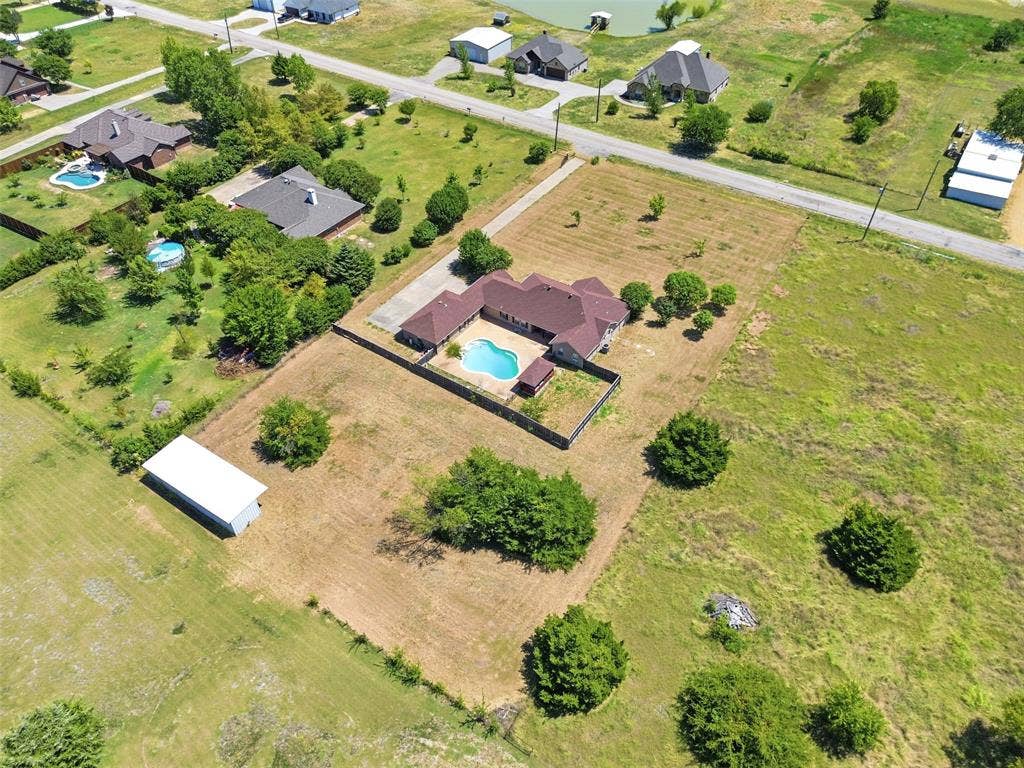 5642 County Road 597, Farmersville, TX 75442 Aerial View featuring the back and side of the property.