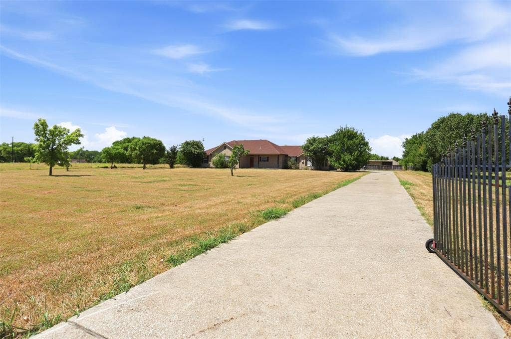5642 County Road 597, Farmersville, TX 75442 Private wrought Iron gate leads to this beautiful ranch style home on