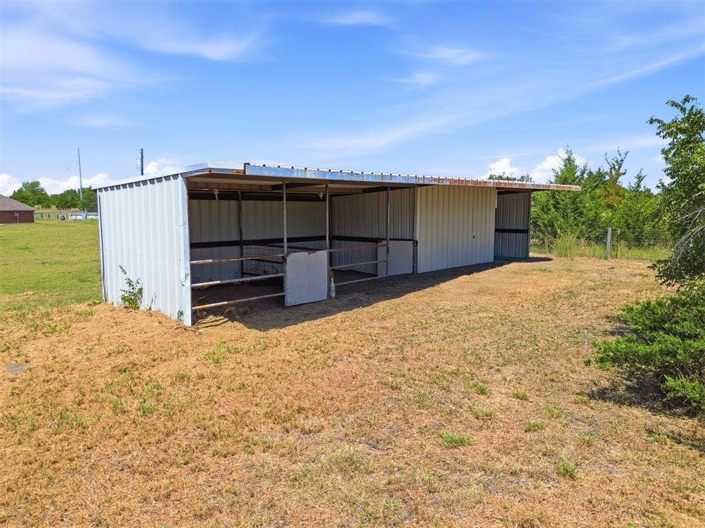 5642 County Road 597, Farmersville, TX 75442 Stable on the property for horses. The property also has a fenced pasture.