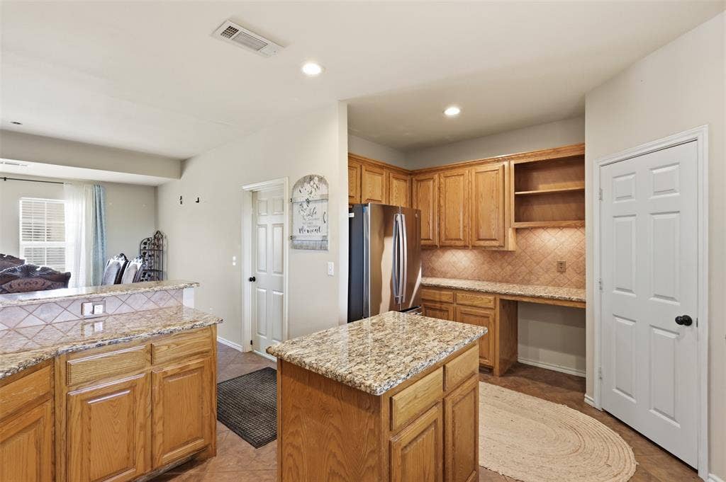 5642 County Road 597, Farmersville, TX 75442 Built-In features include desk and shelves for organizing recipe books.