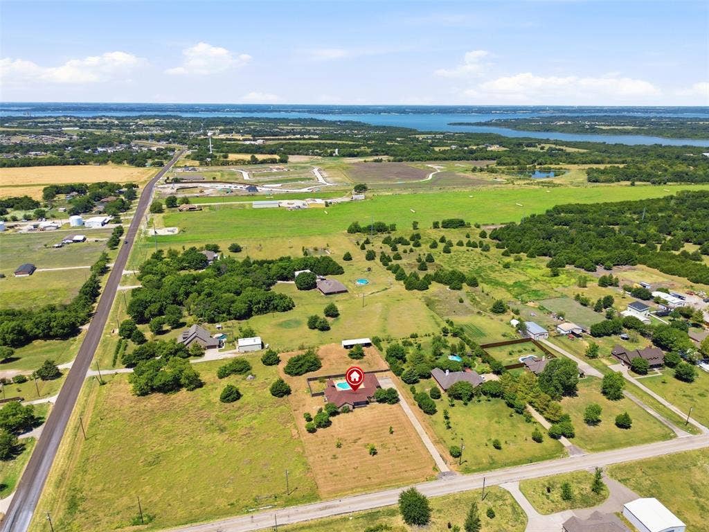 5642 County Road 597, Farmersville, TX 75442 Aerial View shows the property that extends from the driveway to the main road pictured.