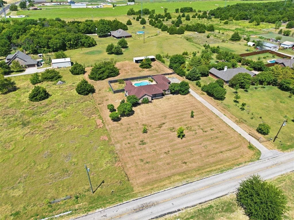 5642 County Road 597, Farmersville, TX 75442 Aerial View detailing the front of the property.