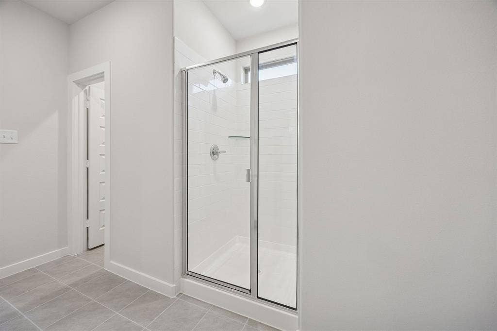Primary Bathroom in the Oak II home plan by Trophy Signature Homes – REPRESENTATIVE PHOTO