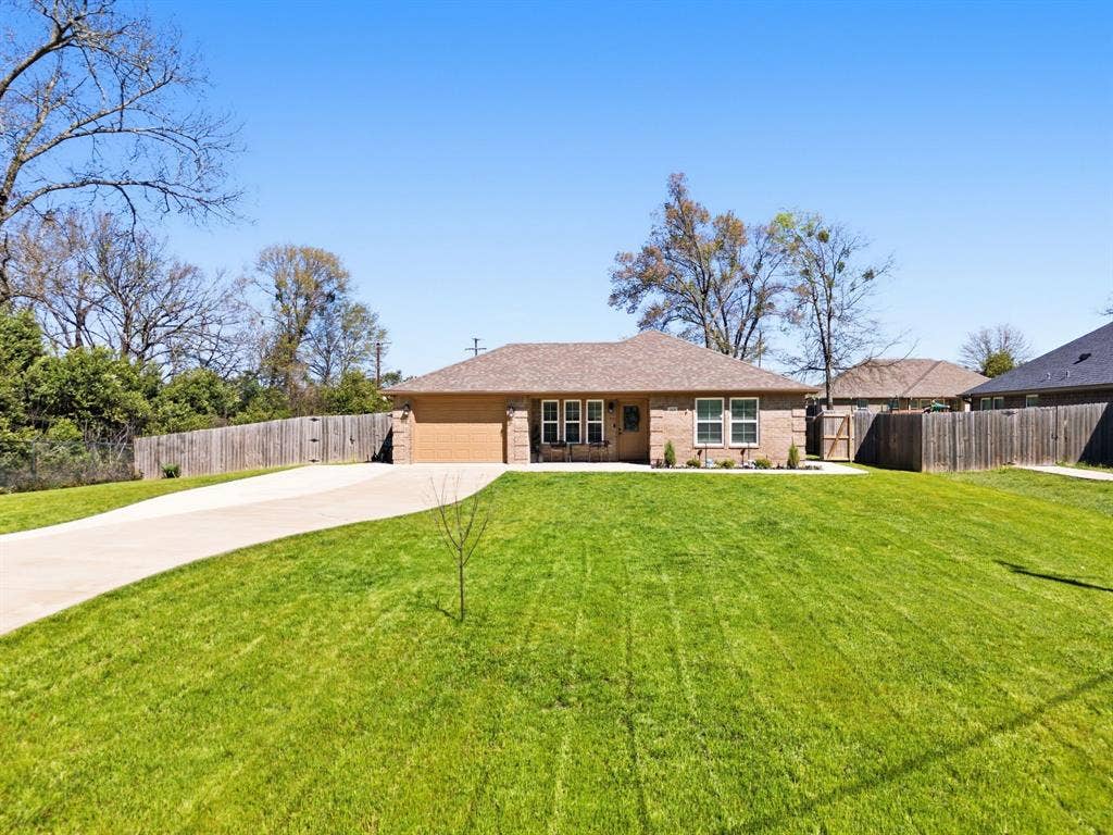 213 Freeman Street, Lindale, TX 75771 Brick exterior with attached garage